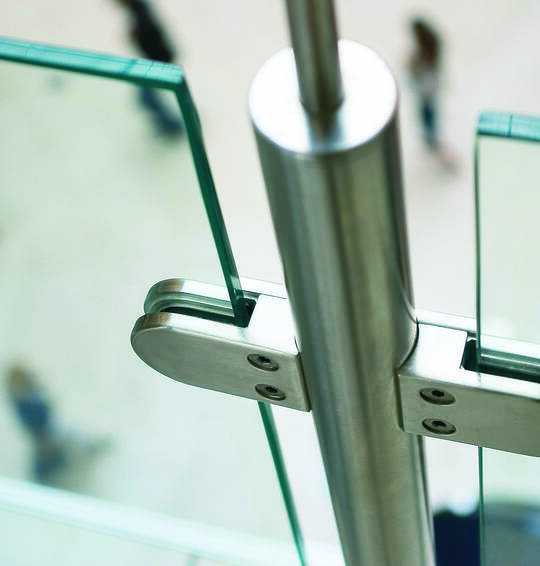 Metal Fittings of glass fence in modern building